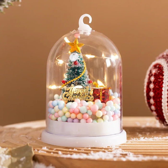 Bola de nieve con árbol de Navidad en miniatura y luces LED